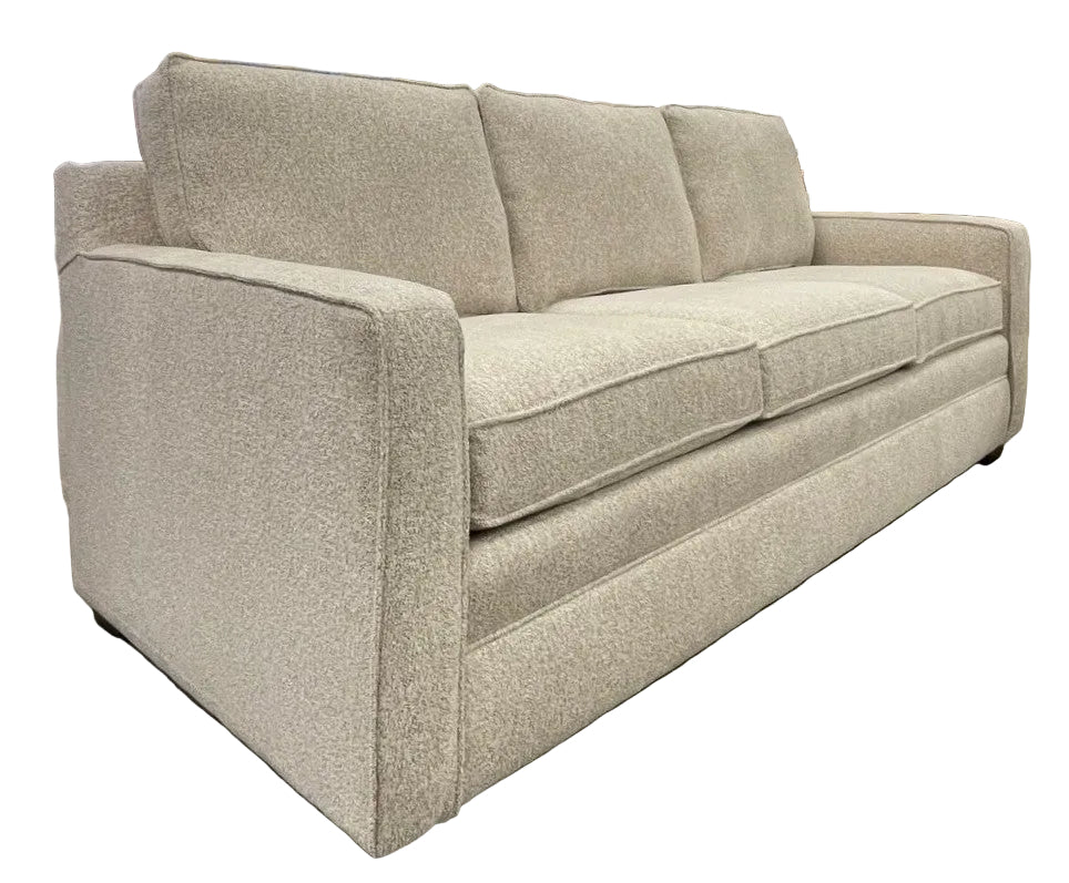 Beige sofa sitting espresso feet