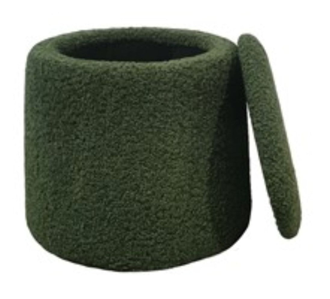 A round green storage ottoman with a a removable top in a chenille textured upholstery.