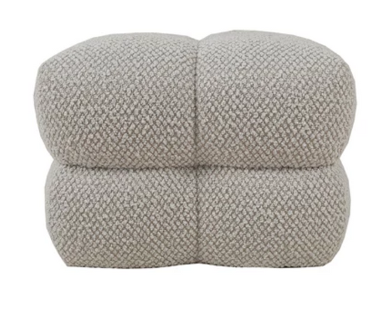 Textured beige tufted ottoman with inset button feet.