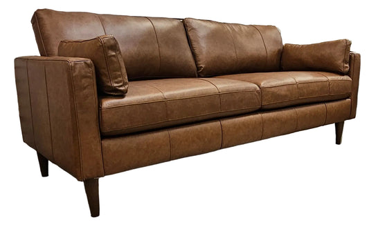 Rust leather two cushion track arm sofa on tapered espresso stain wood legs