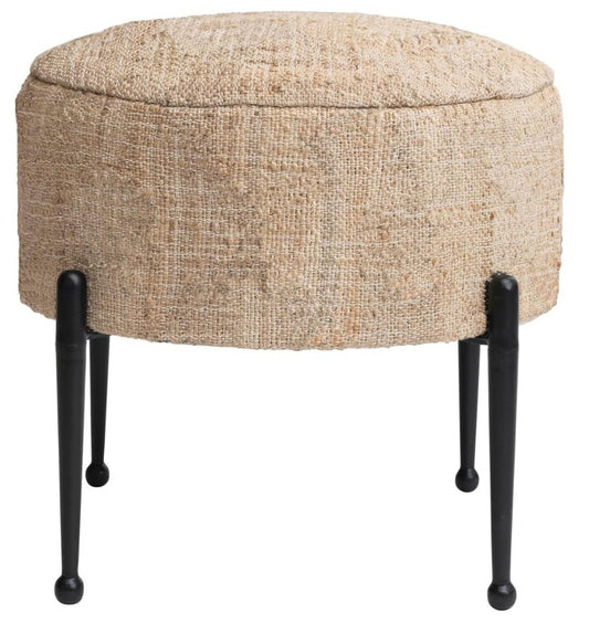 Round ottoman with textured beige cushion atop black metal legs