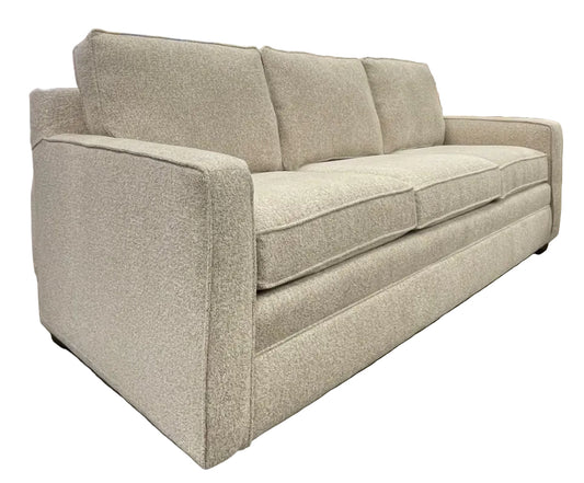 Beige sofa sitting espresso feet